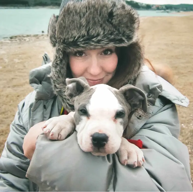 Alissa Zalneraitis, founder of We Feed Raw, holding a cute pup.